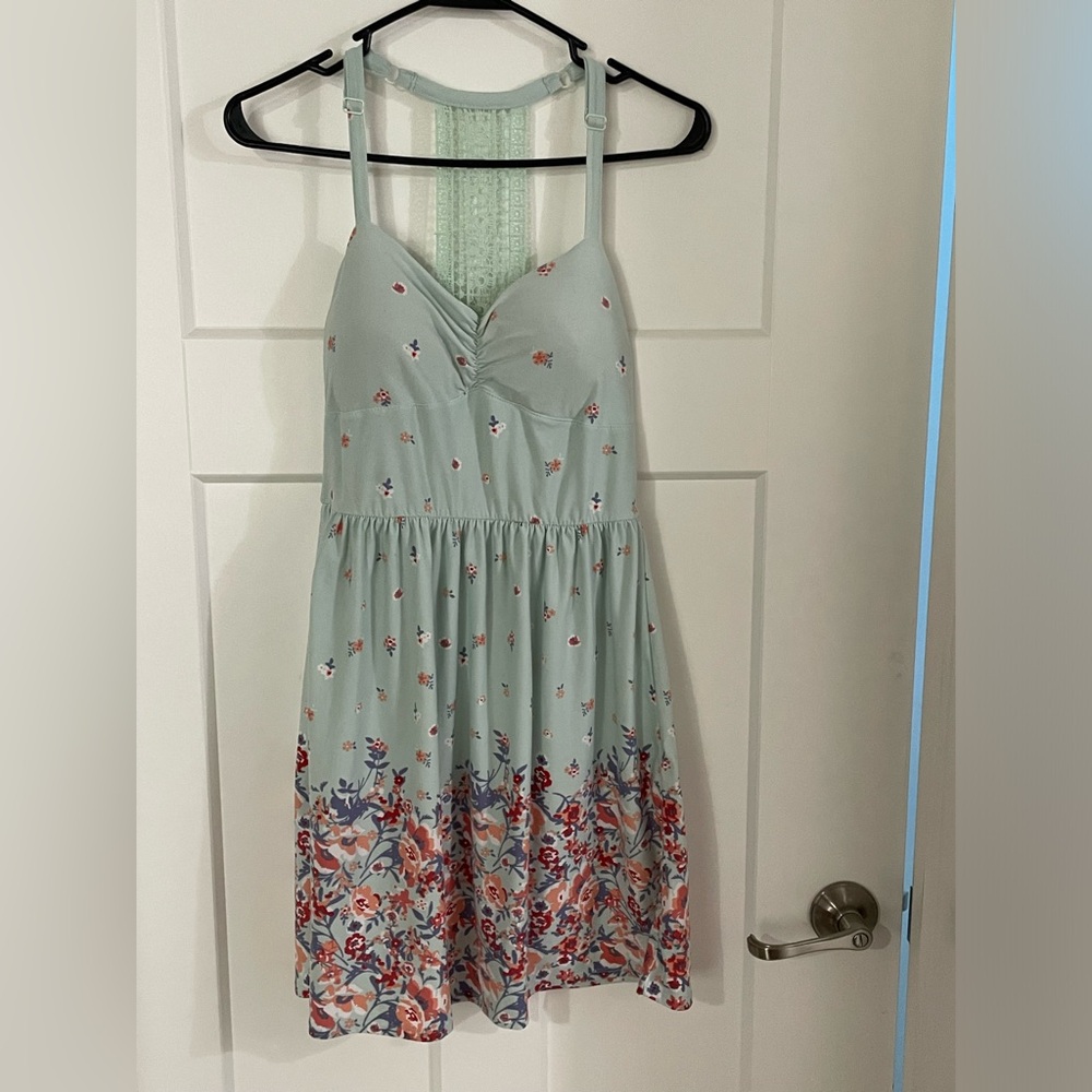 No boundaries dress. The size is a medium. A light blue/ a light teal color.